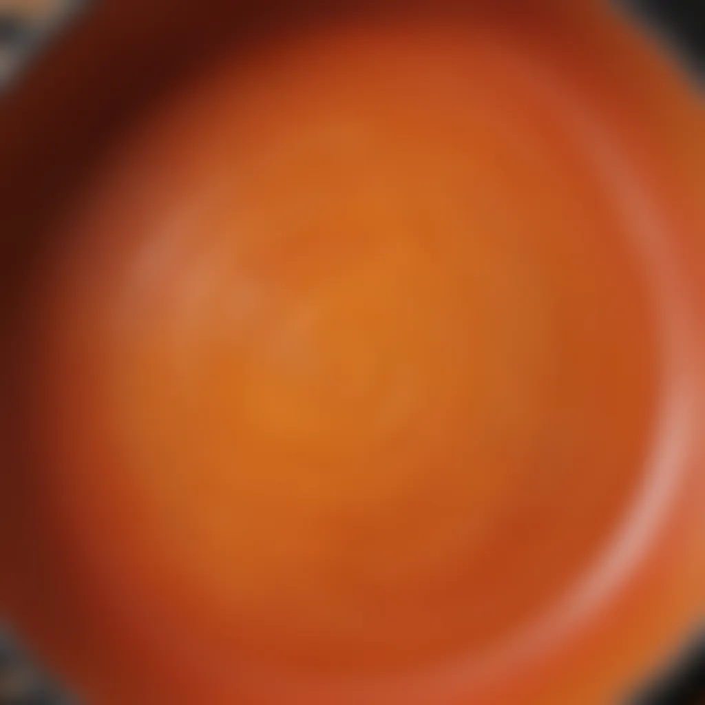 A close-up of a Le Creuset pan showing its unique texture and color