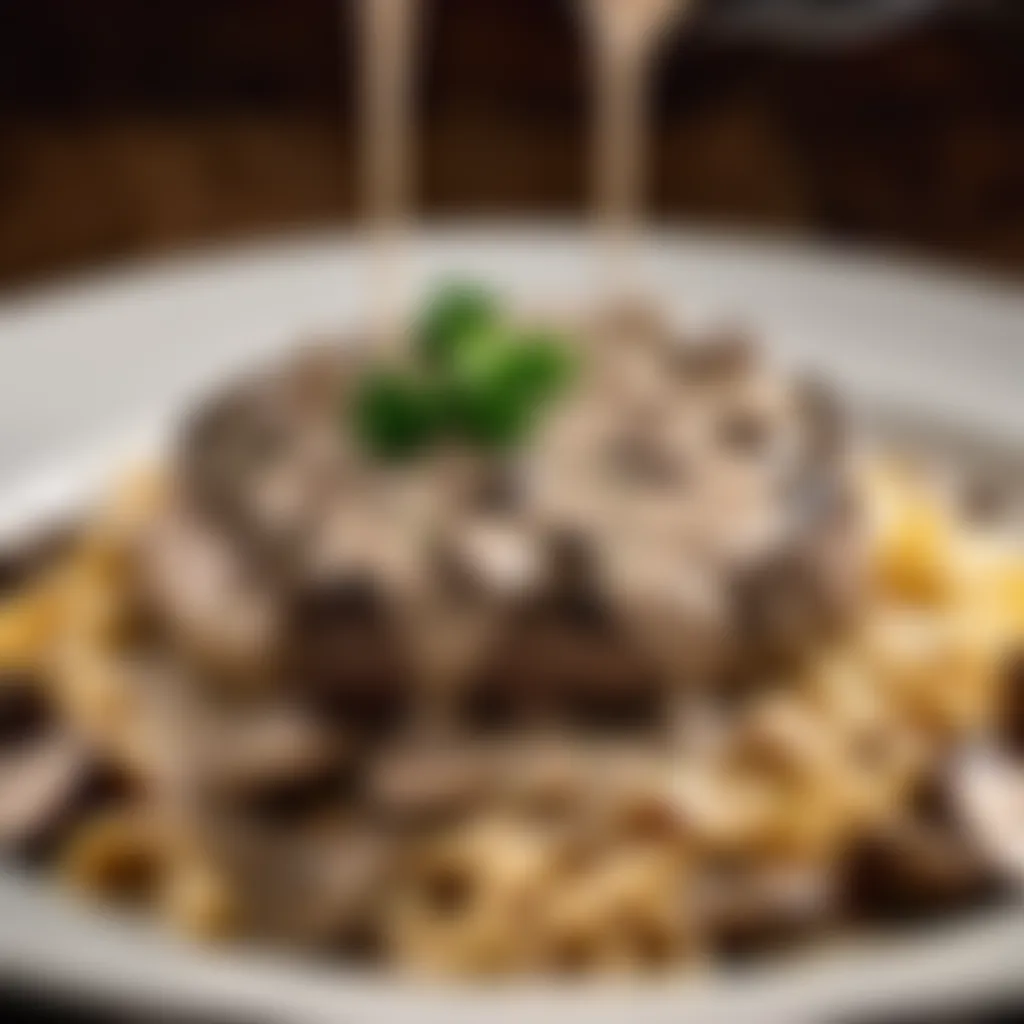 Creamy mushroom sauce being drizzled over beef