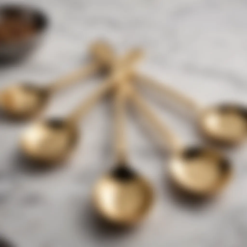 Elegant gold measuring spoons on marble countertop