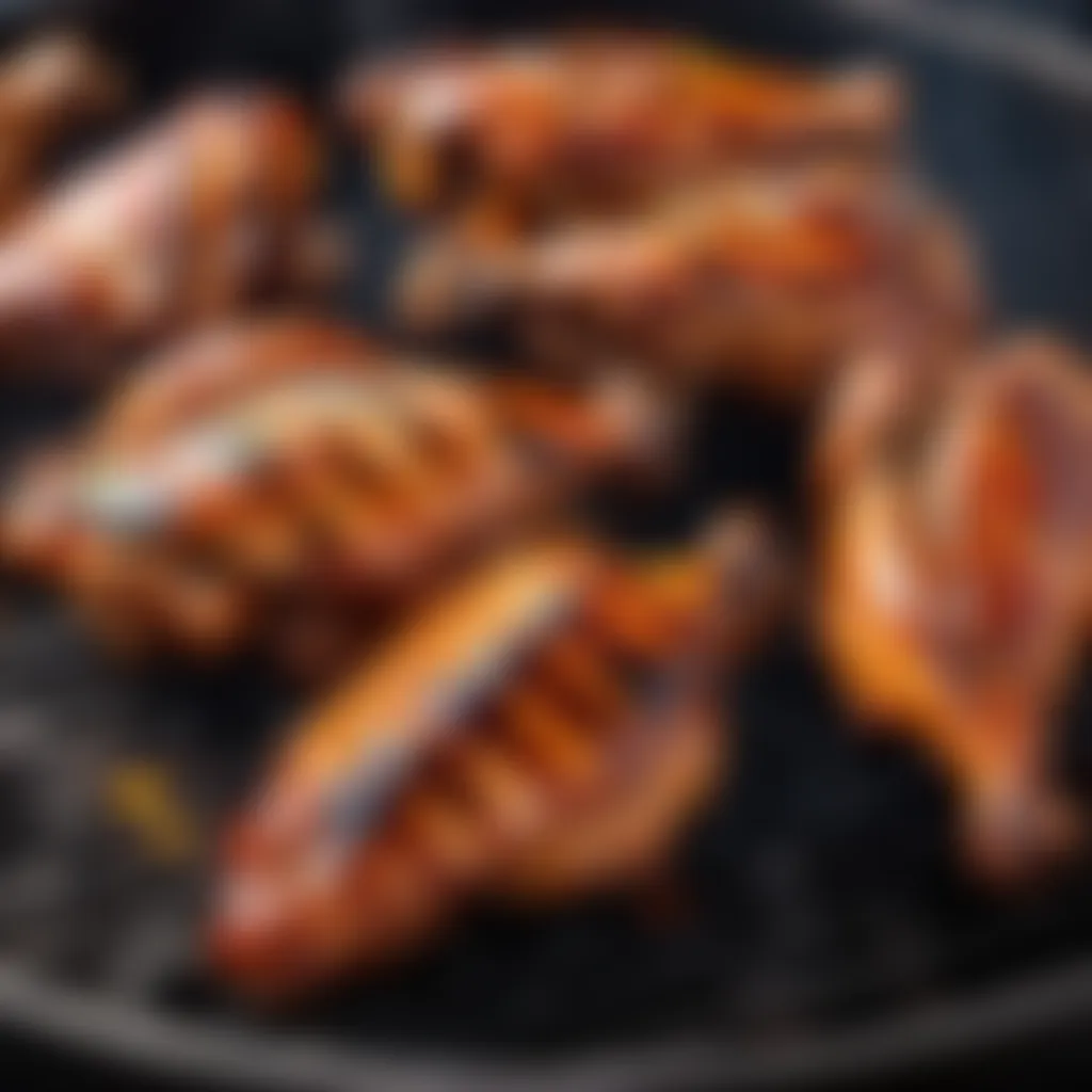 Sizzling Korean-style grilled chicken wings on a charcoal grill