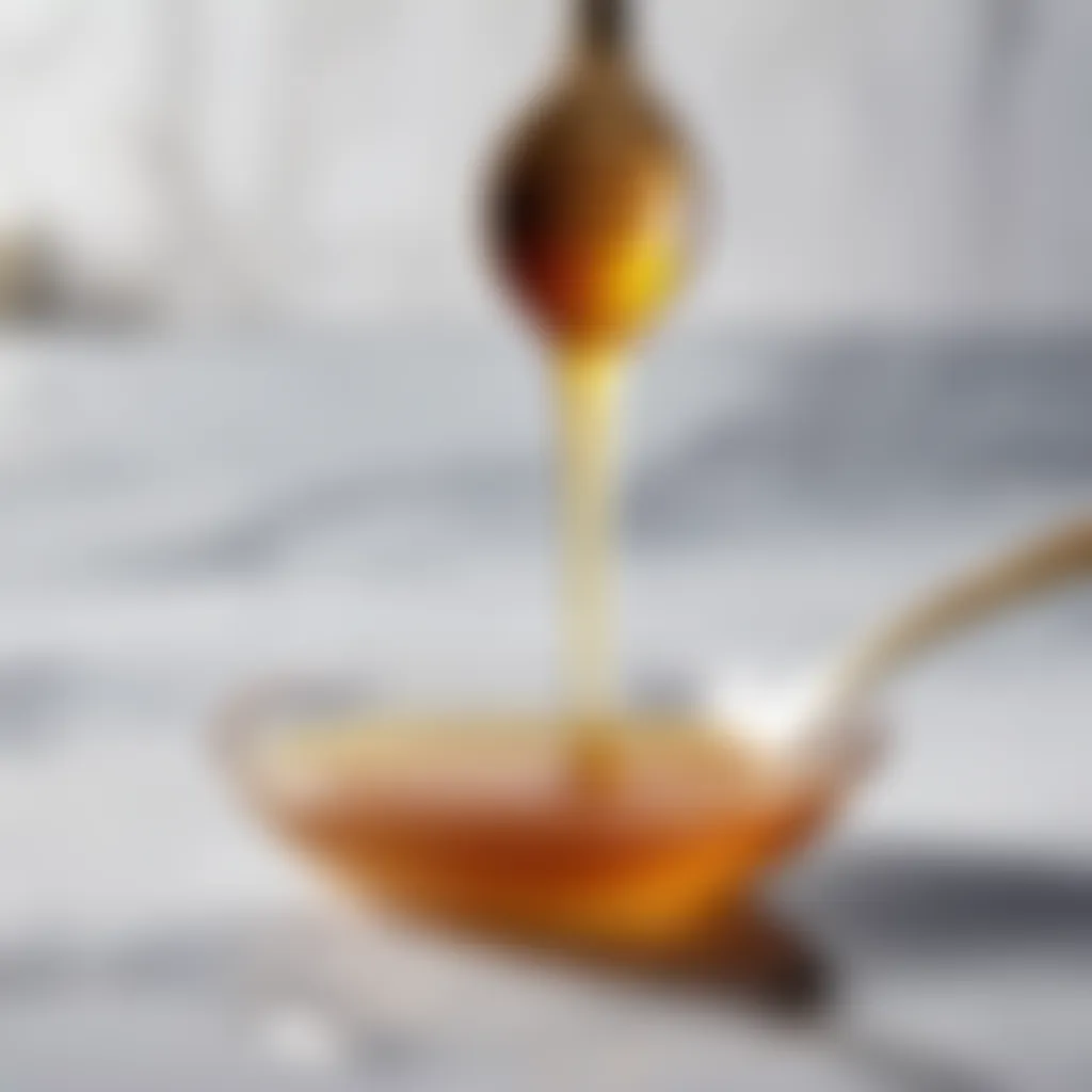 Teaspoon of raw honey on a marble countertop