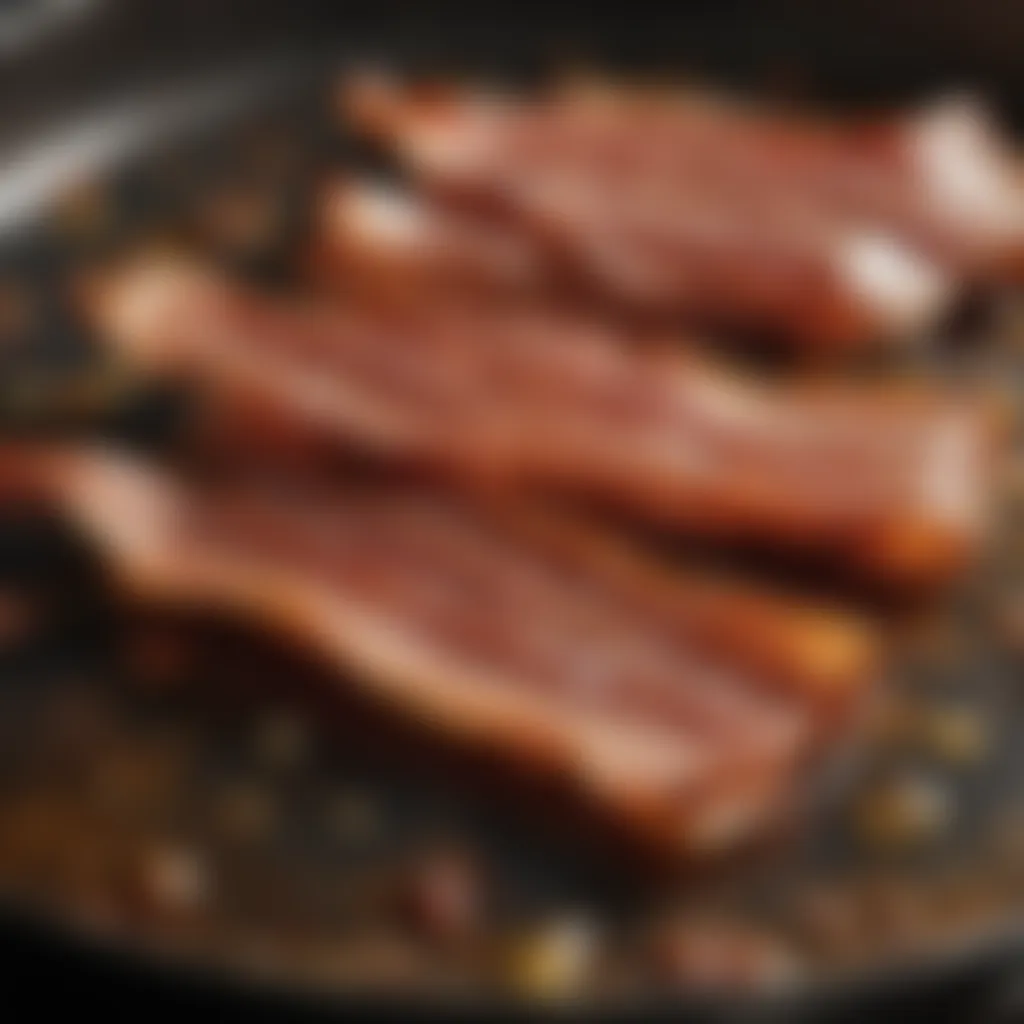 Sizzling bacon in a pan